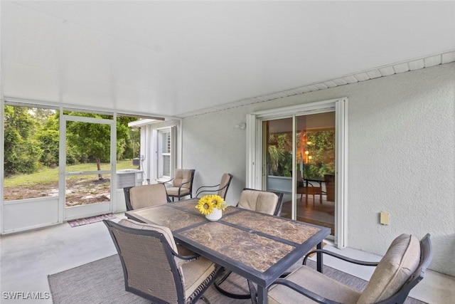 9059 Aegean Cir, Lehigh Acres, FL 33936 - sunroom / solarium with healthy amount of natural light and outdoor dining space