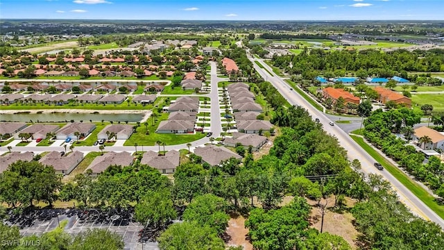 9059 Aegean Cir, Lehigh Acres, FL 33936 - aerial perspective of suburban area with a large body of water