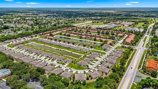 9059 Aegean Cir, Lehigh Acres, FL 33936 - aerial perspective of suburban area with a large body of water