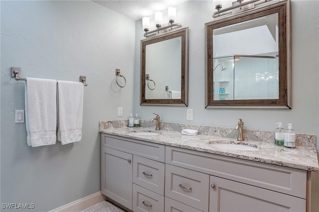 4031 Bayside Rd, Fort Myers Beach, FL 33931 - bathroom with double vanity and a textured ceiling