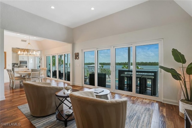 4031 Bayside Rd, Fort Myers Beach, FL 33931 - living area featuring a chandelier, dark wood finished floors, recessed lighting, and a towering ceiling