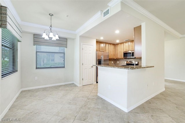 3165 Aviamar Cir Unit 102, Naples, FL 34114 - kitchen featuring stainless steel appliances, tasteful backsplash, stone countertops, a chandelier, and crown molding