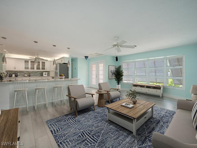 1486 13th Ave N, Naples, FL 34102 - living area featuring wood finished floors and a ceiling fan