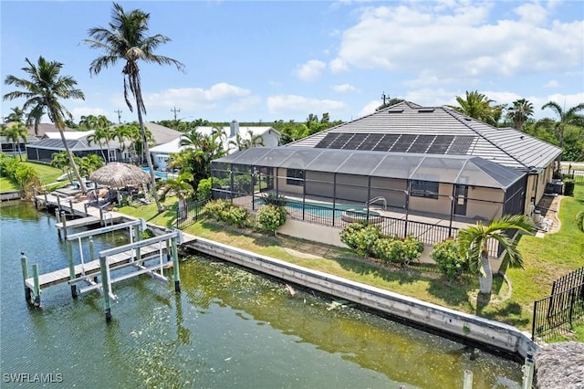 4007 Surfside Blvd, Cape Coral, FL 33914 - dock area with a water view, glass enclosure, and a patio area
