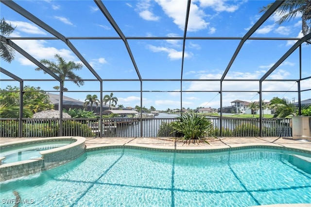 4007 Surfside Blvd, Cape Coral, FL 33914 - view of swimming pool featuring a water view, a lanai, and a pool with connected hot tub