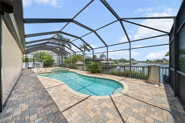 4007 Surfside Blvd, Cape Coral, FL 33914 - view of pool featuring a patio area, a water view, and a pool with connected hot tub