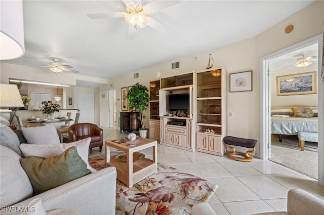 13090 Amberley Ct Unit 1103, Bonita Springs, FL 34135 - living room featuring a ceiling fan and light tile patterned floors