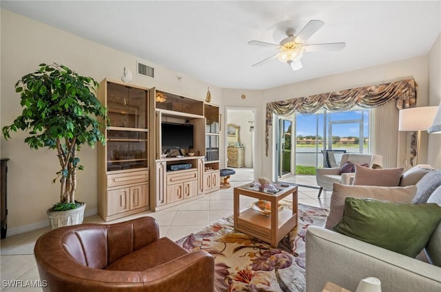 13090 Amberley Ct Unit 1103, Bonita Springs, FL 34135 - living room featuring light tile patterned flooring and a ceiling fan