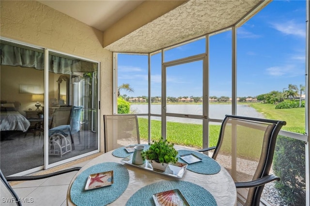 13090 Amberley Ct Unit 1103, Bonita Springs, FL 34135 - sunroom with a water view