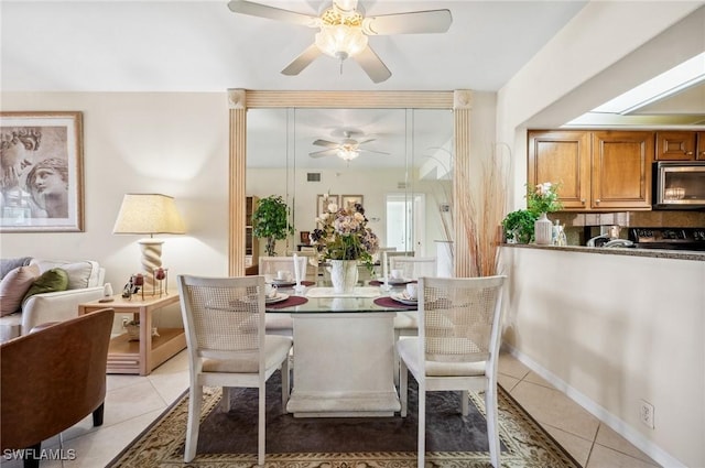 13090 Amberley Ct Unit 1103, Bonita Springs, FL 34135 - dining space with ceiling fan and light tile patterned floors