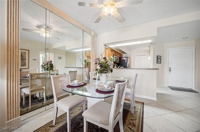 13090 Amberley Ct Unit 1103, Bonita Springs, FL 34135 - dining space with a ceiling fan and light tile patterned floors
