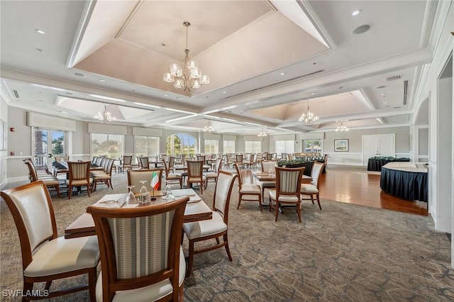 13090 Amberley Ct Unit 1103, Bonita Springs, FL 34135 - carpeted dining space featuring a chandelier, crown molding, coffered ceiling, and a raised ceiling