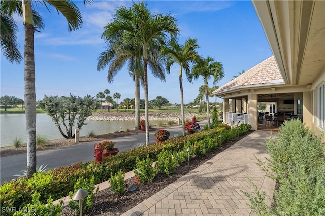 13090 Amberley Ct Unit 1103, Bonita Springs, FL 34135 - view of patio featuring a water view