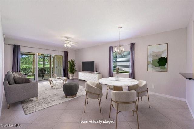 12330 Notting Hill Ln Unit 14, Bonita Springs, FL 34135 - tiled dining area featuring a chandelier and ceiling fan