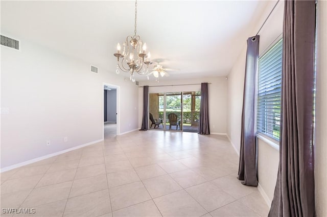 12330 Notting Hill Ln Unit 14, Bonita Springs, FL 34135 - empty room featuring a chandelier and light tile patterned floors
