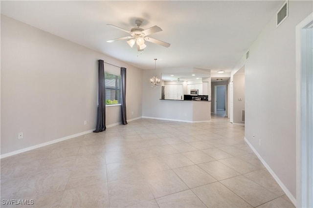 12330 Notting Hill Ln Unit 14, Bonita Springs, FL 34135 - unfurnished living room with a ceiling fan, a chandelier, and light tile patterned floors