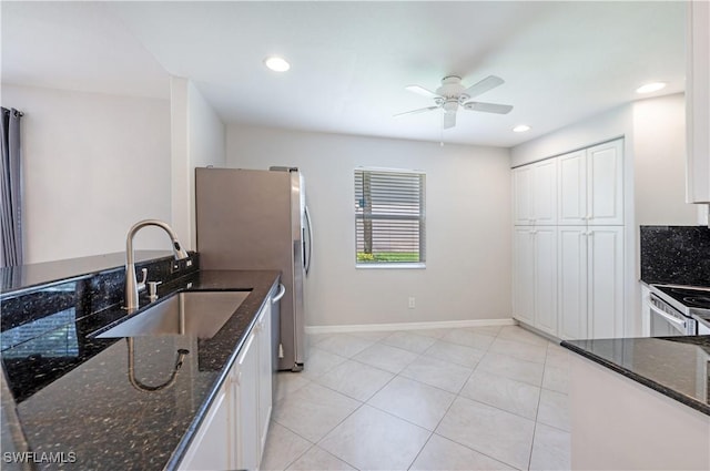12330 Notting Hill Ln Unit 14, Bonita Springs, FL 34135 - kitchen with ceiling fan, white cabinetry, dark stone countertops, appliances with stainless steel finishes, and recessed lighting