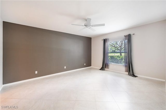 12330 Notting Hill Ln Unit 14, Bonita Springs, FL 34135 - spare room with ceiling fan and light tile patterned floors