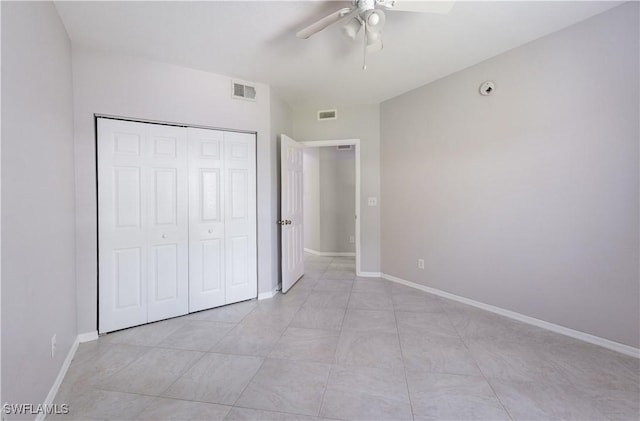 12330 Notting Hill Ln Unit 14, Bonita Springs, FL 34135 - unfurnished bedroom with a closet and a ceiling fan