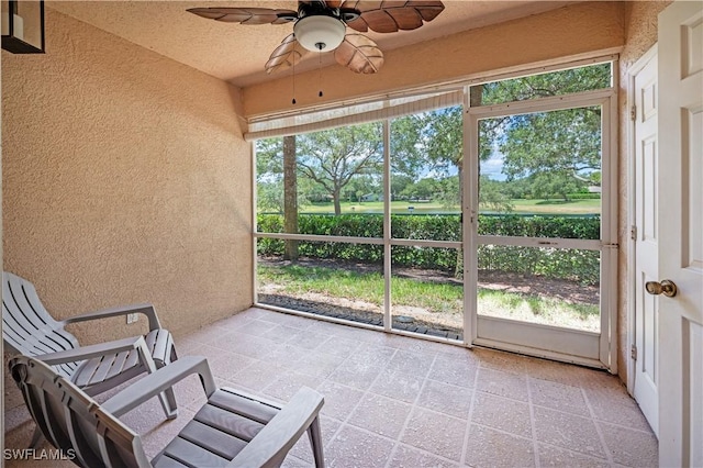 12330 Notting Hill Ln Unit 14, Bonita Springs, FL 34135 - unfurnished sunroom featuring a ceiling fan