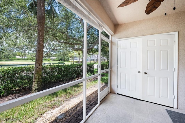 12330 Notting Hill Ln Unit 14, Bonita Springs, FL 34135 - unfurnished sunroom with a ceiling fan