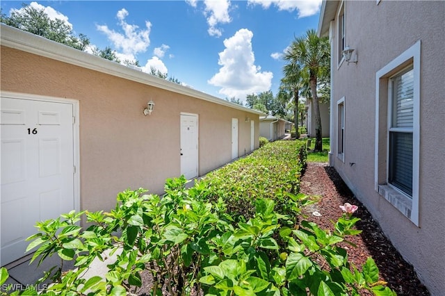 12330 Notting Hill Ln Unit 14, Bonita Springs, FL 34135 - view of home's exterior with stucco siding