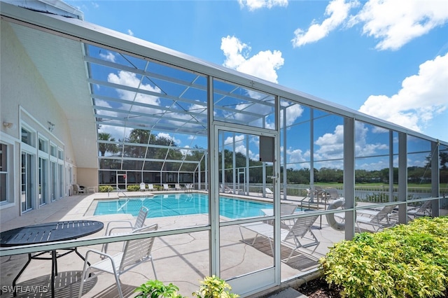 12330 Notting Hill Ln Unit 14, Bonita Springs, FL 34135 - community pool with a patio area and a lanai