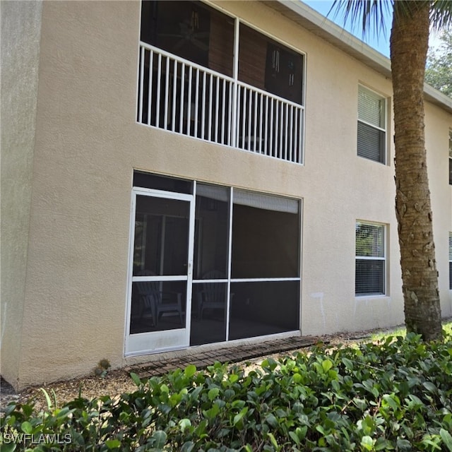 12330 Notting Hill Ln Unit 14, Bonita Springs, FL 34135 - rear view of property featuring stucco siding