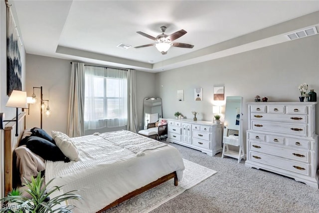 43837 Cattleman Dr, Punta Gorda, FL 33982 - bedroom with light colored carpet, a raised ceiling, and ceiling fan