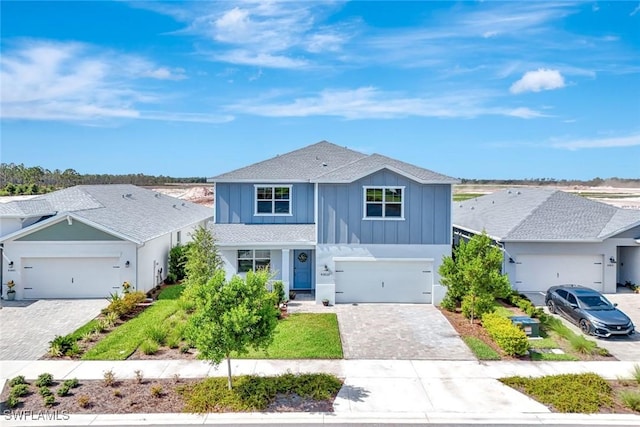 43837 Cattleman Dr, Punta Gorda, FL 33982 - traditional home featuring board and batten siding, decorative driveway, and a shingled roof