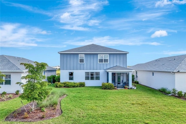 43837 Cattleman Dr, Punta Gorda, FL 33982 - back of house featuring a lawn, board and batten siding, and roof with shingles