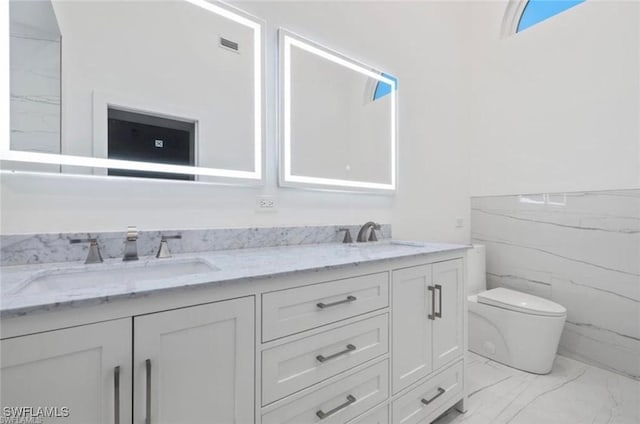 16131 Kelly Woods Dr, Fort Myers, FL 33908 - full bathroom with marble finish floors and double vanity