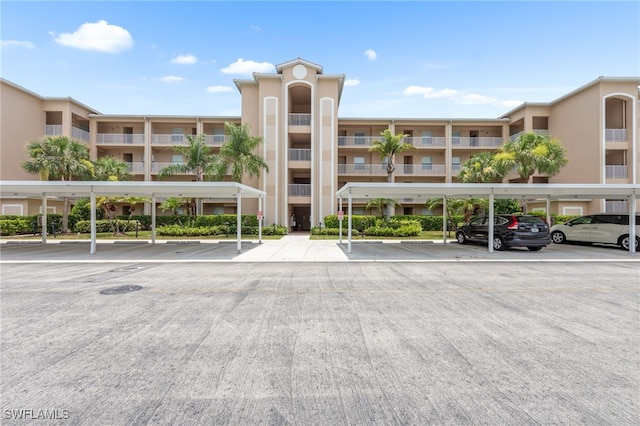 8550 Kingbird Loop Unit 629, Estero, FL 33967 - view of apartment building / complex with covered parking