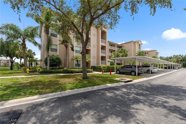 8550 Kingbird Loop Unit 629, Estero, FL 33967 - view of building exterior with covered parking