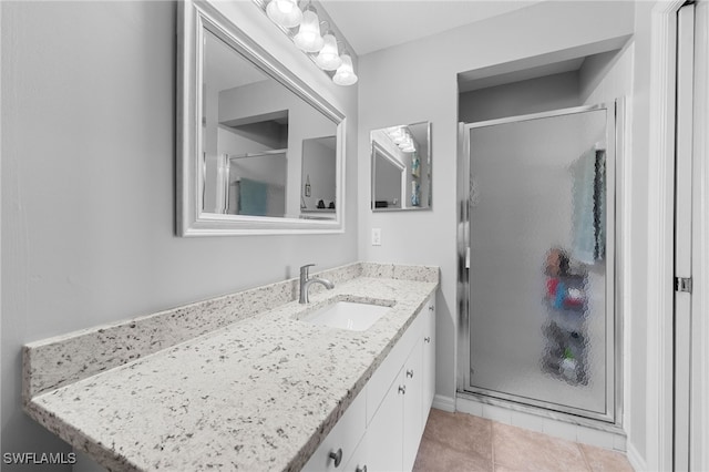 8550 Kingbird Loop Unit 629, Estero, FL 33967 - full bath featuring vanity, a stall shower, and tile patterned floors