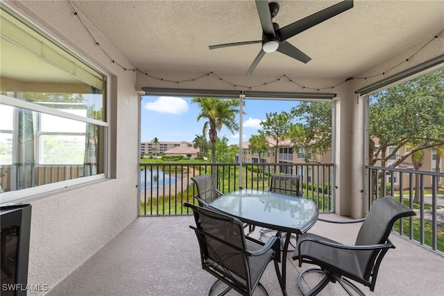 8550 Kingbird Loop Unit 629, Estero, FL 33967 - balcony featuring a ceiling fan, a residential view, outdoor dining area, and a water view