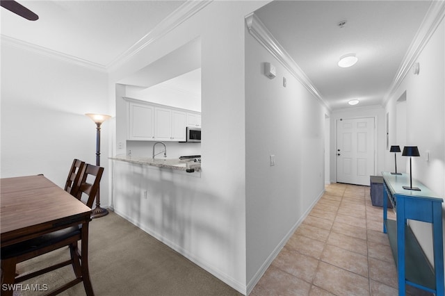8550 Kingbird Loop Unit 629, Estero, FL 33967 - hallway featuring ornamental molding and light tile patterned floors