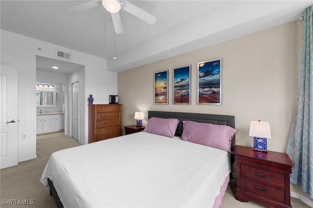 8550 Kingbird Loop Unit 629, Estero, FL 33967 - bedroom with light carpet, ensuite bathroom, and ceiling fan