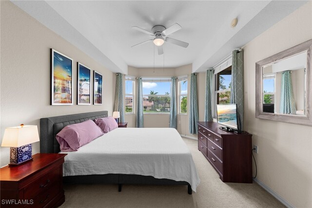 8550 Kingbird Loop Unit 629, Estero, FL 33967 - bedroom with light colored carpet and a ceiling fan