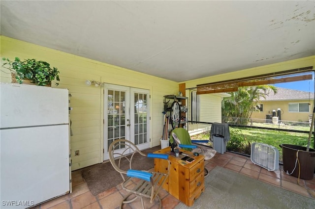 1720 NW 14th Pl, Cape Coral, FL 33993 - view of patio / terrace with french doors