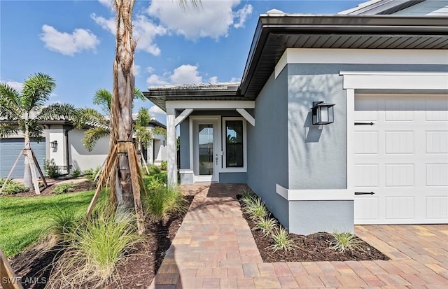 6144 Liberty St, Ave Maria, FL 34142 - doorway to property featuring stucco siding