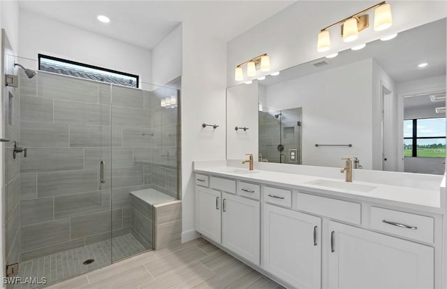 6144 Liberty St, Ave Maria, FL 34142 - full bathroom with double vanity, a shower stall, and recessed lighting