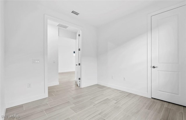 6144 Liberty St, Ave Maria, FL 34142 - empty room with wood tiled floors and baseboards