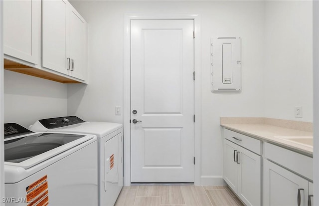 6144 Liberty St, Ave Maria, FL 34142 - laundry area with separate washer and dryer, cabinet space, and electric panel