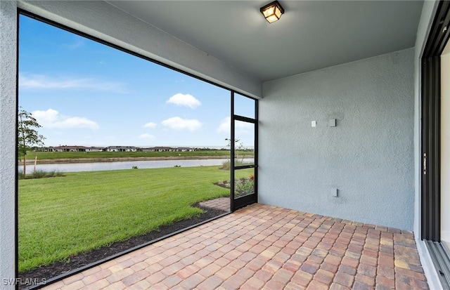 6144 Liberty St, Ave Maria, FL 34142 - unfurnished sunroom featuring a water view