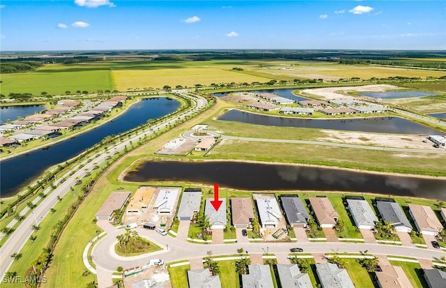 6144 Liberty St, Ave Maria, FL 34142 - aerial overview of property's location with a nearby body of water and nearby suburban area