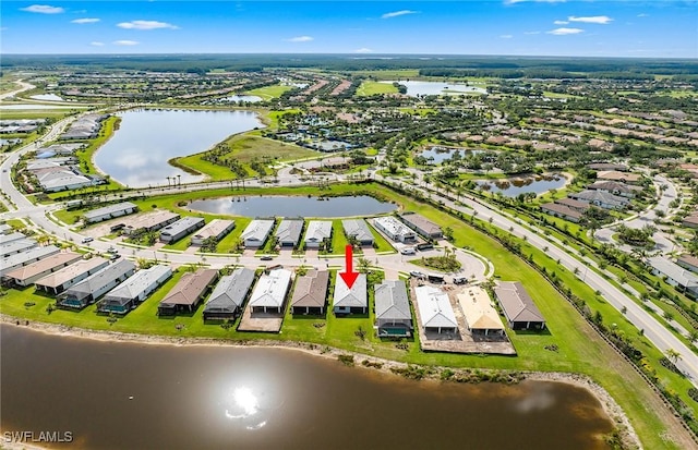 6144 Liberty St, Ave Maria, FL 34142 - aerial perspective of suburban area featuring a large body of water