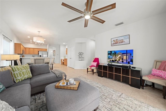 9795 Gladiolus Bulb Loop, Fort Myers, FL 33908 - living room with light tile patterned flooring, a ceiling fan, a chandelier, and recessed lighting