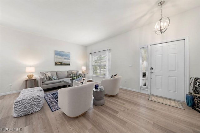 9795 Gladiolus Bulb Loop, Fort Myers, FL 33908 - living area with wood finished floors and a chandelier