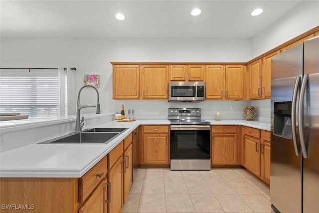 9795 Gladiolus Bulb Loop, Fort Myers, FL 33908 - kitchen with stainless steel appliances, light countertops, a peninsula, light tile patterned floors, and recessed lighting